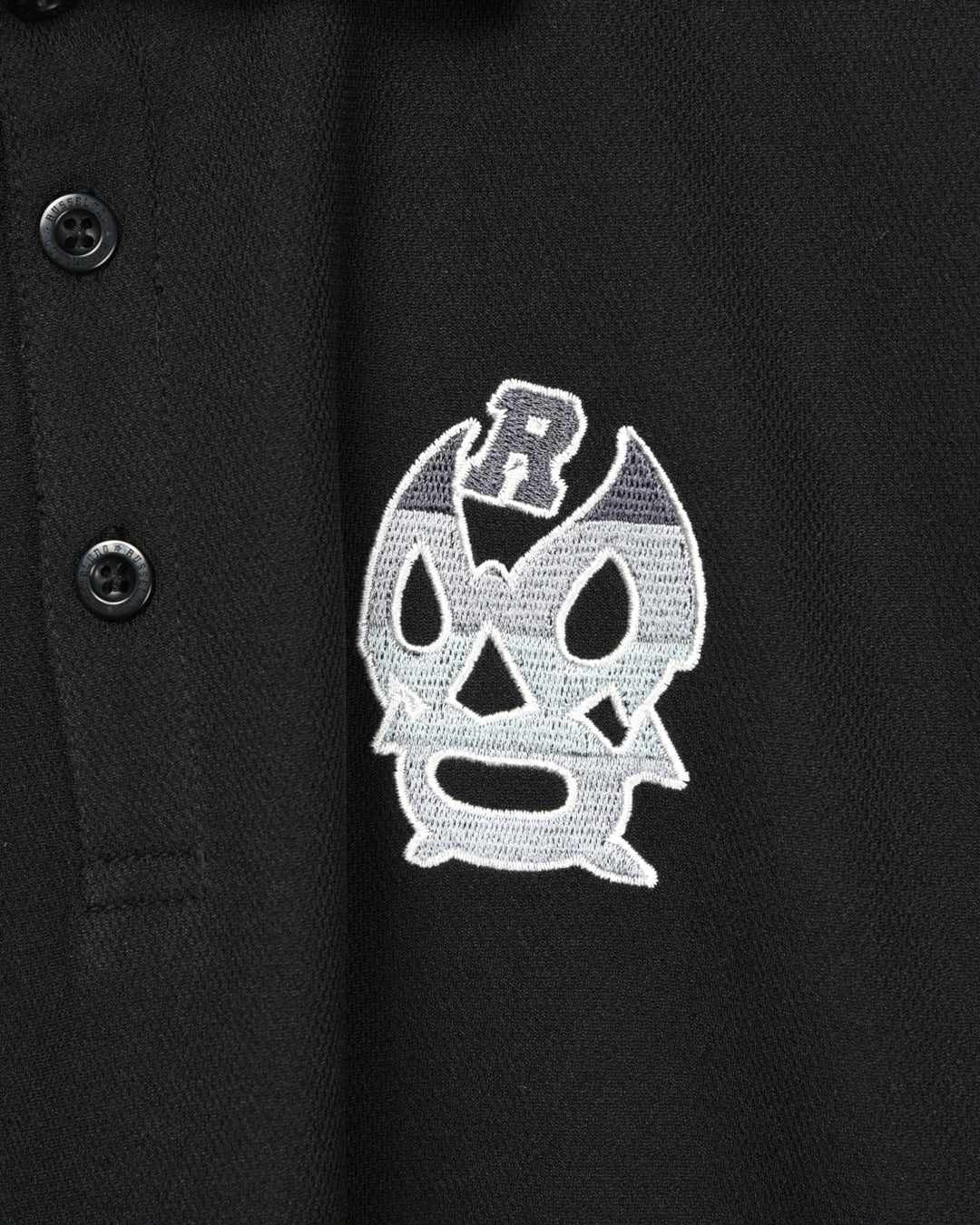 Lucha coat of arms polo